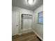 Bathroom with a tub and shower, updated fixtures and tile, and natural light from the window at 1070 French Quarter Creek Rd, Huger, SC 29450