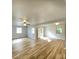 The expansive living area offers wood floors, a ceiling fan, and ample natural light at 1070 French Quarter Creek Rd, Huger, SC 29450