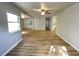 Sunlit living space with wood floors leads to kitchen and dining, offering modern open concept at 1070 French Quarter Creek Rd, Huger, SC 29450