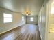 Spacious main bedroom with wood-look floors, plenty of natural light, and adjoining bathroom at 1070 French Quarter Creek Rd, Huger, SC 29450