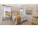 This bedroom features neutral paint colors, a decorative lighting fixture, and large windows at 109 Moscato Ln, Summerville, SC 29485