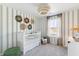This room has natural light, cute lion decorations, patterned walls, and a fuzzy white chandelier at 108 Moscato Ln, Summerville, SC 29485