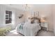 This bedroom features a patterned wallpaper, decorative lighting, and white accents at 109 Moscato Ln, Summerville, SC 29485