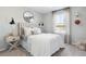 Stylish bedroom featuring a modern headboard, natural light, and neutral decor at 108 Moscato Ln, Summerville, SC 29485