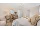 This bedroom features neutral paint colors, a decorative mirror, and an upholstered chair at 109 Moscato Ln, Summerville, SC 29485