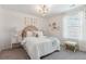 Cozy bedroom with patterned wallpaper, plush bedding, and stylish decor for a comfortable and inviting space at 108 Moscato Ln, Summerville, SC 29485