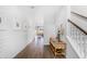 Welcoming entryway featuring wood floors, shiplap accent wall, and a staircase at 109 Moscato Ln, Summerville, SC 29485