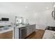 Open-concept kitchen with granite island, stainless dishwasher, and views to the living area at 109 Moscato Ln, Summerville, SC 29485
