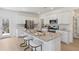 Modern kitchen features a large island, stainless steel appliances, and ample cabinet space at 108 Moscato Ln, Summerville, SC 29485