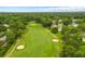 Aerial shot of golf course with lush green fairways and strategically placed sand traps at 114 Shadowmoss Pkwy, Charleston, SC 29414
