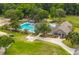Aerial view of community pool area, clubhouse, and green space at 114 Shadowmoss Pkwy, Charleston, SC 29414