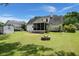 Well maintained backyard with a cozy fire pit and plenty of space for outdoor activities at 114 Shadowmoss Pkwy, Charleston, SC 29414