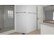 Bathroom with glass door shower and chrome towel racks, next to an open doorway at 114 Shadowmoss Pkwy, Charleston, SC 29414