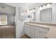 Bright bathroom featuring double sinks, vanity, and a view of an adjacent bedroom at 114 Shadowmoss Pkwy, Charleston, SC 29414