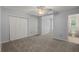 Carpeted bedroom featuring a ceiling fan, closet, and access to an adjacent bathroom at 114 Shadowmoss Pkwy, Charleston, SC 29414