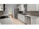 Bright and stylish kitchen featuring white cabinets, stainless steel appliances, and modern finishes at 114 Shadowmoss Pkwy, Charleston, SC 29414