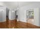 Open living space featuring hardwood floors and a seamless transition to the kitchen and staircase at 114 Shadowmoss Pkwy, Charleston, SC 29414