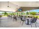 Covered patio with tables and chairs; great for outdoor dining at 114 Shadowmoss Pkwy, Charleston, SC 29414