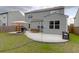 Landscaped backyard with a patio, seating, grill and a well-maintained lawn perfect for outdoor enjoyment at 114 W Bradford Pointe Dr, Summerville, SC 29483