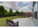 Secluded backyard area featuring a concrete patio, seating, grill, and well-maintained grassy area at 114 W Bradford Pointe Dr, Summerville, SC 29483