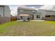 Spacious backyard with patio, grill, seating, and well-maintained lawn, perfect for entertaining and relaxation at 114 W Bradford Pointe Dr, Summerville, SC 29483