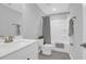 Modern bathroom with a shower-tub combo, sleek vanity, and neutral tones, offering a clean and serene space at 114 W Bradford Pointe Dr, Summerville, SC 29483
