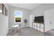 Bright bedroom featuring a table, built-in storage, and a large window at 114 W Bradford Pointe Dr, Summerville, SC 29483