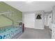 Well-lit bedroom featuring stylish bed and play area, providing a comfortable and functional space at 114 W Bradford Pointe Dr, Summerville, SC 29483