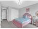 Bright bedroom showcases a comfortable bed, wardrobe, and a cute decor desk, perfect for relaxation and storage at 114 W Bradford Pointe Dr, Summerville, SC 29483