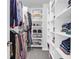 Walk-in closet with carpet, shelving, and clothes rods, offering ample storage and organization at 114 W Bradford Pointe Dr, Summerville, SC 29483