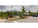 Community pool area with lush landscaping, seating, and a covered pavilion, perfect for relaxing and socializing at 114 W Bradford Pointe Dr, Summerville, SC 29483