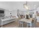 Elegant dining area with modern lighting, open to the living space and kitchen, perfect for entertaining and Gathering gatherings at 114 W Bradford Pointe Dr, Summerville, SC 29483