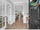 Elegant entryway with hardwood floors, open sightlines, and stylish doors leading to other rooms in the house at 114 W Bradford Pointe Dr, Summerville, SC 29483