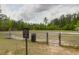 Community sports field enclosed with a fence and including soccer goals, bench, and waste receptacle at 114 W Bradford Pointe Dr, Summerville, SC 29483
