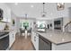 Open-concept kitchen showcasing a spacious island with stainless steel dishwasher, perfect for modern living and entertaining at 114 W Bradford Pointe Dr, Summerville, SC 29483