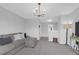 Upstairs living room featuring a comfortable sectional couch, stylish light fixture, and TV at 114 W Bradford Pointe Dr, Summerville, SC 29483