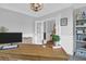 Bright home office with neutral walls, stylish desk, elegant light fixture, and a large window for natural light at 114 W Bradford Pointe Dr, Summerville, SC 29483