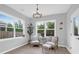 Cozy sitting area featuring stylish furnishings, bright windows, and elegant light fixture at 114 W Bradford Pointe Dr, Summerville, SC 29483