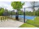 Community tennis courts are fenced, with sidewalks and bicycle racks at 114 W Bradford Pointe Dr, Summerville, SC 29483