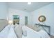 Bright bedroom featuring a neutral palette and an elegant mirror, creating a peaceful and stylish space at 1204 Twin Rivers Drive, Wando, SC 29492