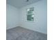 Cozy bedroom with plush carpeting and a sunlit window providing a bright and inviting atmosphere at 1204 Twin Rivers Drive, Wando, SC 29492