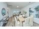 Cozy open-concept living space connecting the dining room to a comfortable sitting area, bright and airy at 1204 Twin Rivers Drive, Wando, SC 29492