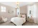 Charming bedroom with patterned wallpaper, chandelier lighting, sheer curtains, and plush carpet at 122 Moscato Ln, Summerville, SC 29485
