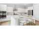 Elegant kitchen with white cabinets, stainless appliances, and a marble-top island at 122 Moscato Ln, Summerville, SC 29485