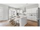 Stylish kitchen with marble island, modern appliances, and counter seating at 122 Moscato Ln, Summerville, SC 29485