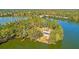 Beautiful aerial view showcasing a secluded home with lush greenery on a private peninsula surrounded by tranquil waters at 126 Maritime Way, Summerville, SC 29485