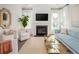 Bright living room with fireplace, stylish decor, and large windows offering plenty of natural light at 126 Maritime Way, Summerville, SC 29485