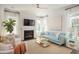Bright living room with fireplace, stylish decor, and large windows offering plenty of natural light at 126 Maritime Way, Summerville, SC 29485