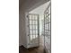Open french doors leading into bedroom, displaying hardwood floors and lots of natural light at 139 Summerwind Dr, Summerville, SC 29486