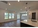Spacious living room with hardwood floors, recessed lighting and large windows providing a view of the front yard at 139 Summerwind Dr, Summerville, SC 29486